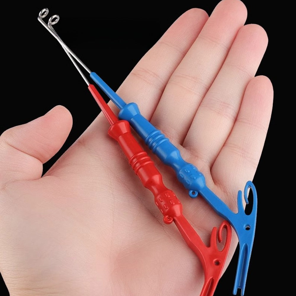 Compact hook remover tools resting in an open hand